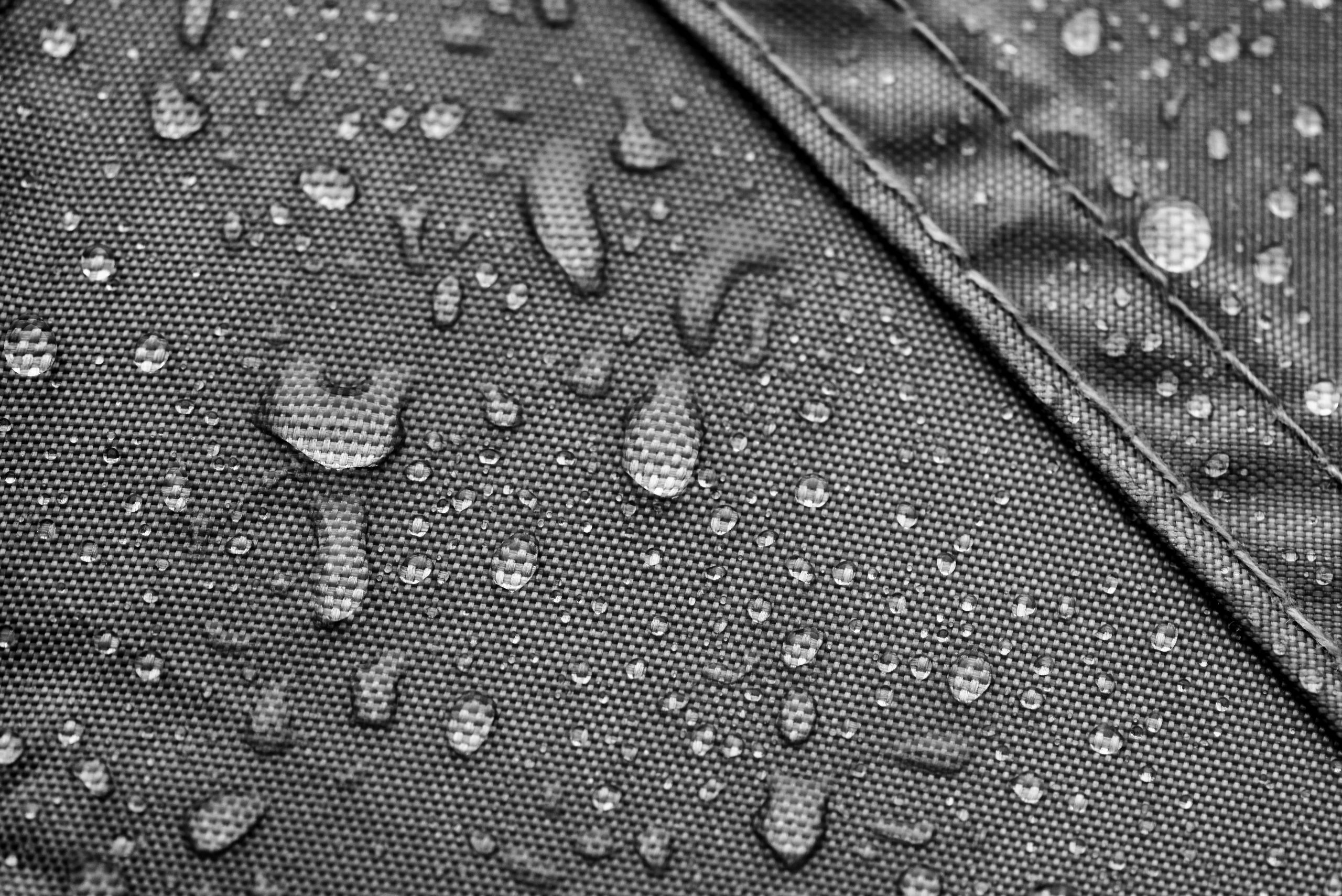 Grey rainproof tent sheet with rain drops